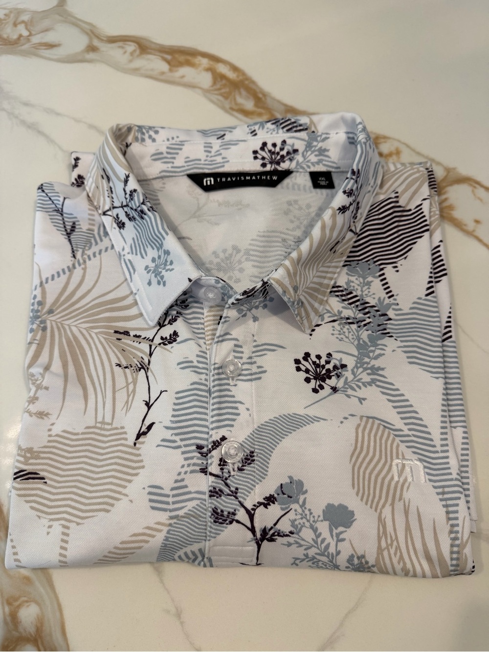 Travis Mathew White Polo with Light Blue and Tan Botanical Print